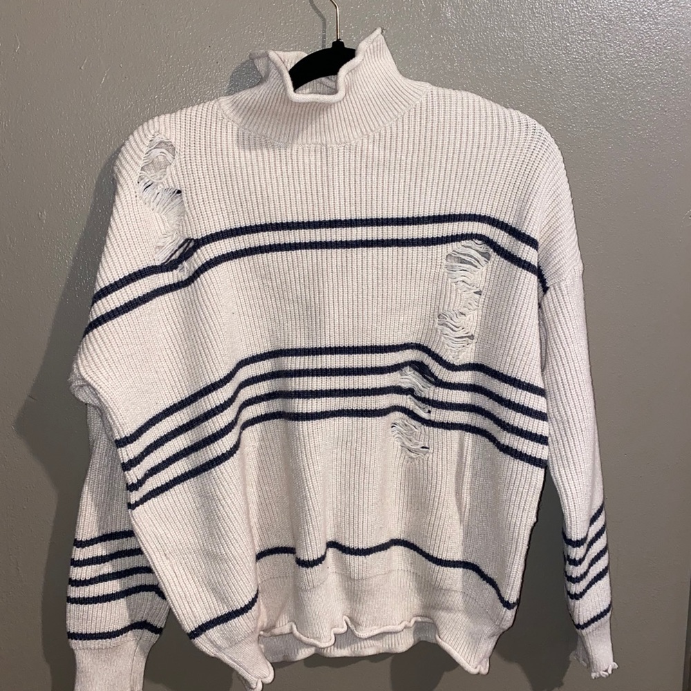 Distressed turtleneck sweater
